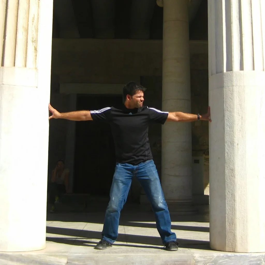 Chad Reilly posing like Samson in Athens, Greece.