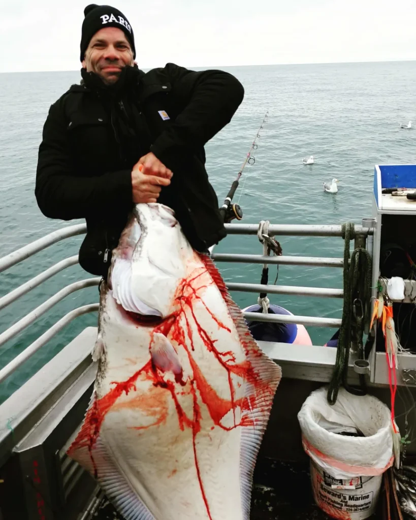 Chad Reilly with 80 lb halibut.