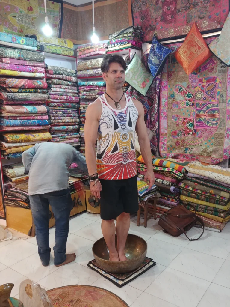 Standing in a singing bowl. Goa, India.