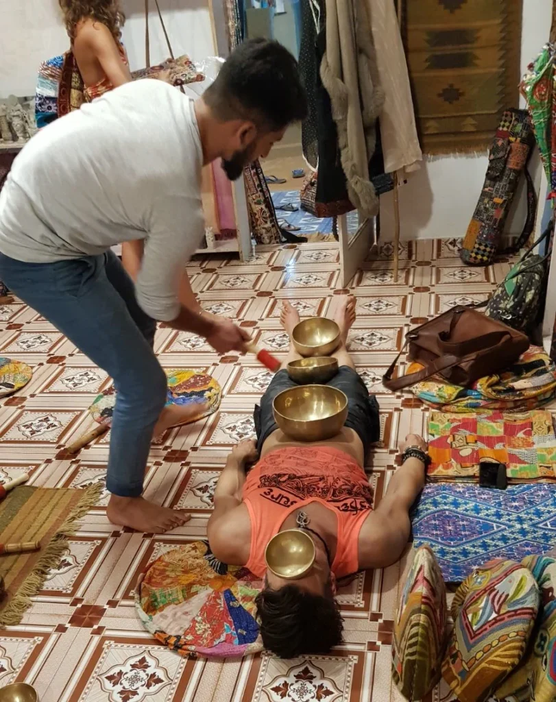 Supine singing bowls in Goa.